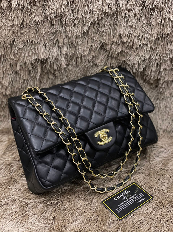 Shoulder bag made of the finest leather materials - handle and shoulder - and adjustable shoulder strap - from Chanel for women - Black