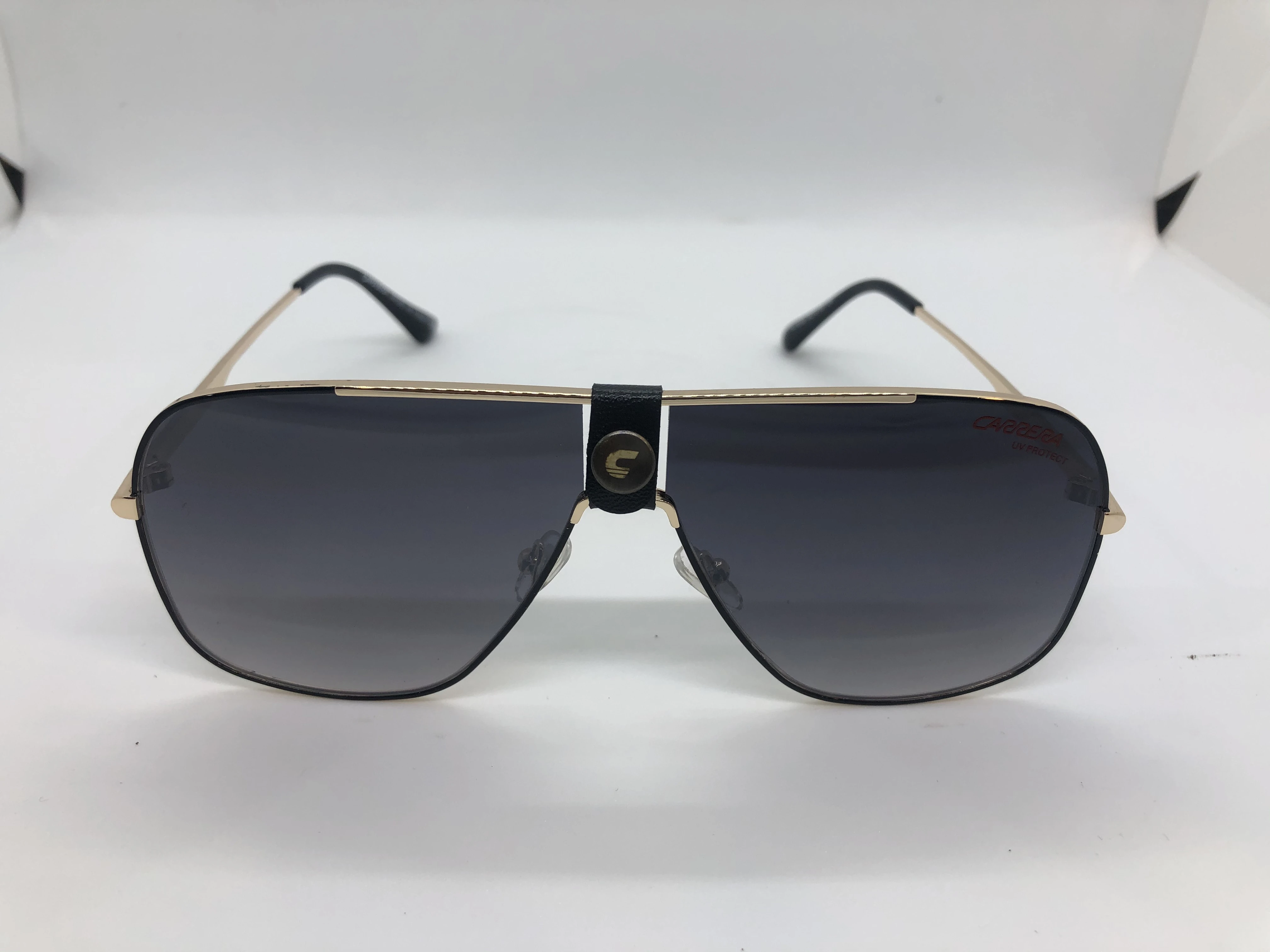 Sunglasses - from Carrera - with a golden metal frame - and black lenses - and golden metal arms - for men