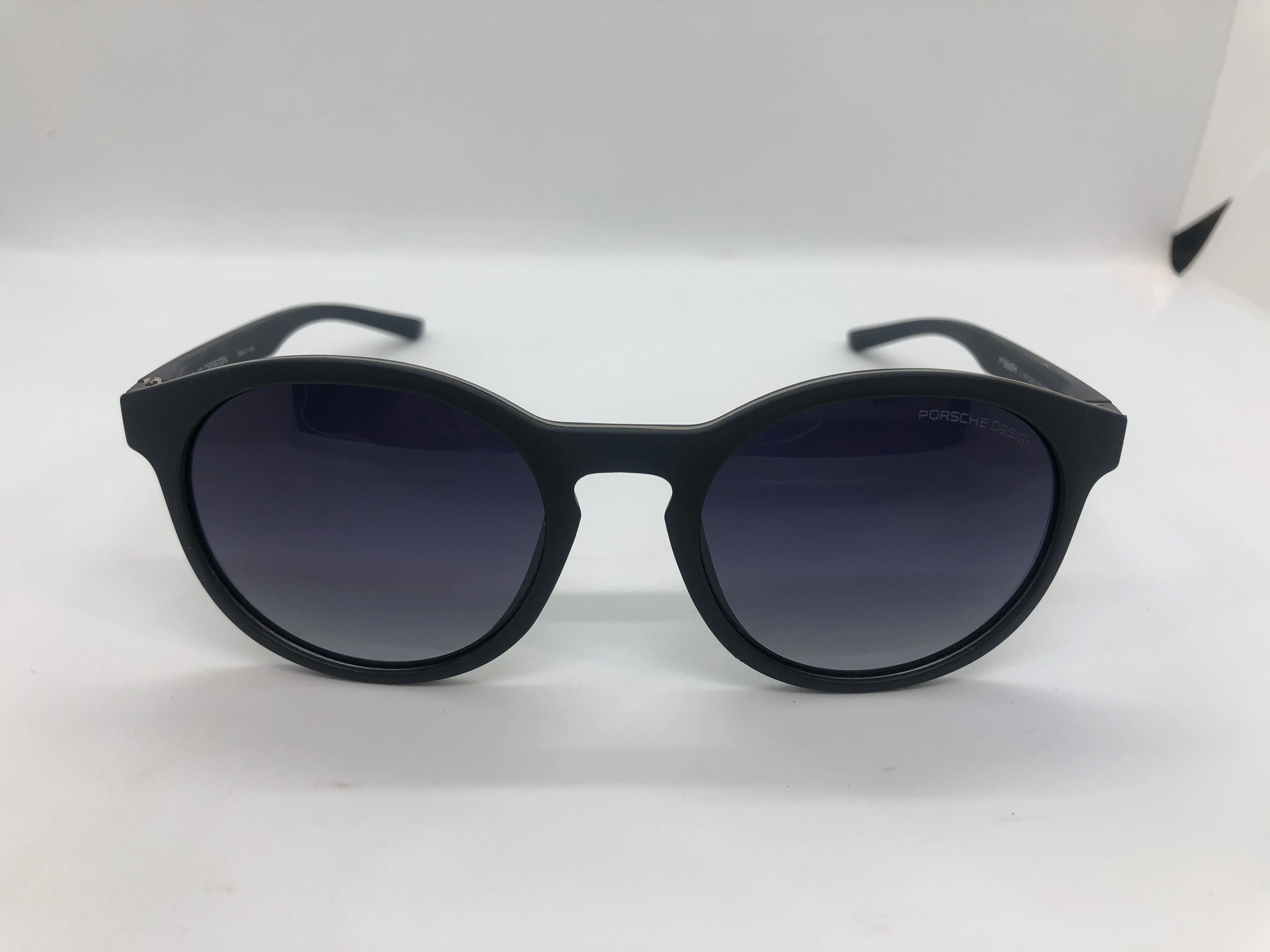 Sunglasses - Porsche Design - with a black frame polycarbonate - black gradient lenses - and a black arm - for men