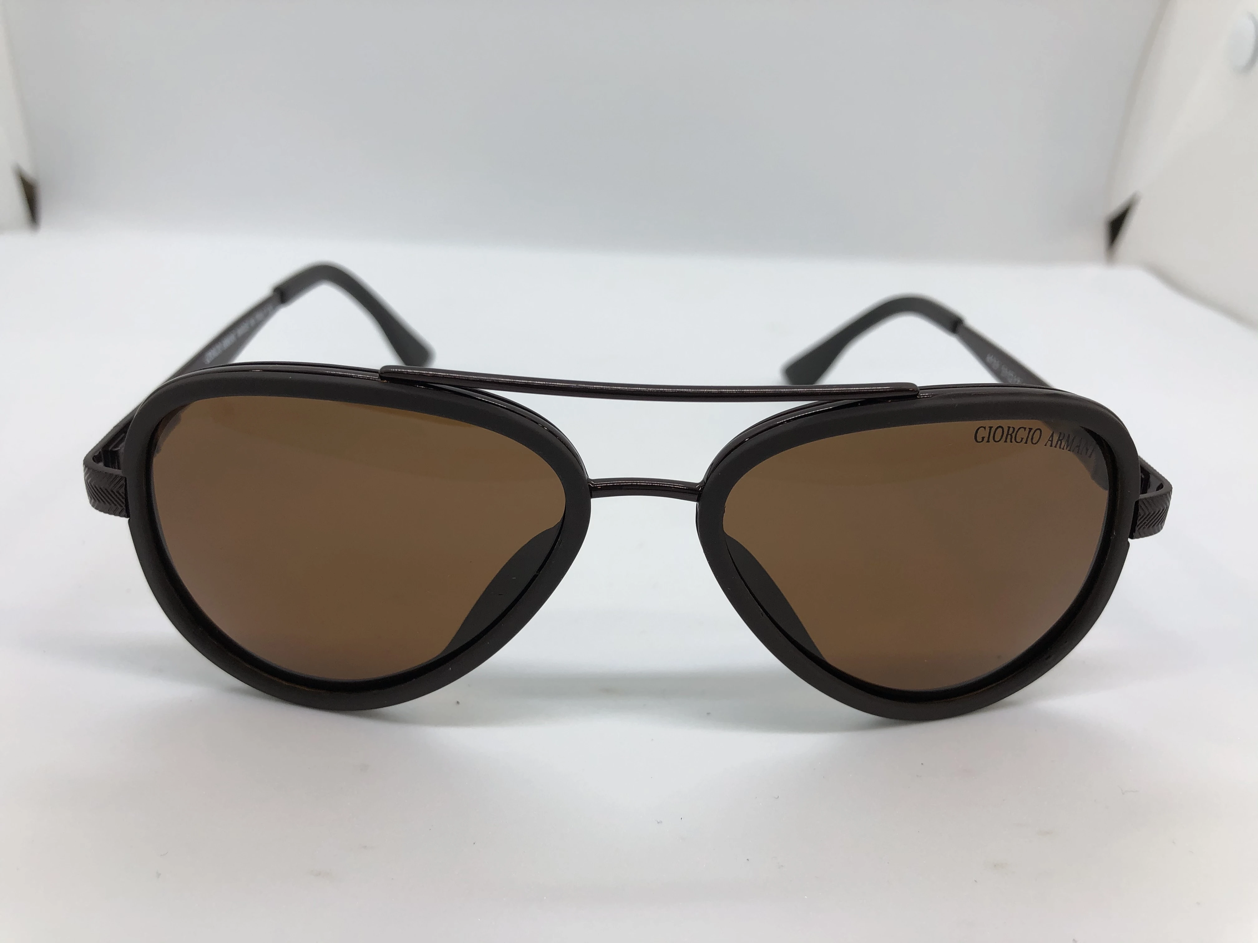 Sunglasses - by Giorgio Armani - with a dark brown frame polycarbonate and brown shiny metal - and brown lenses - and a dark brown metal frame - with a dark brown brand logo - for men