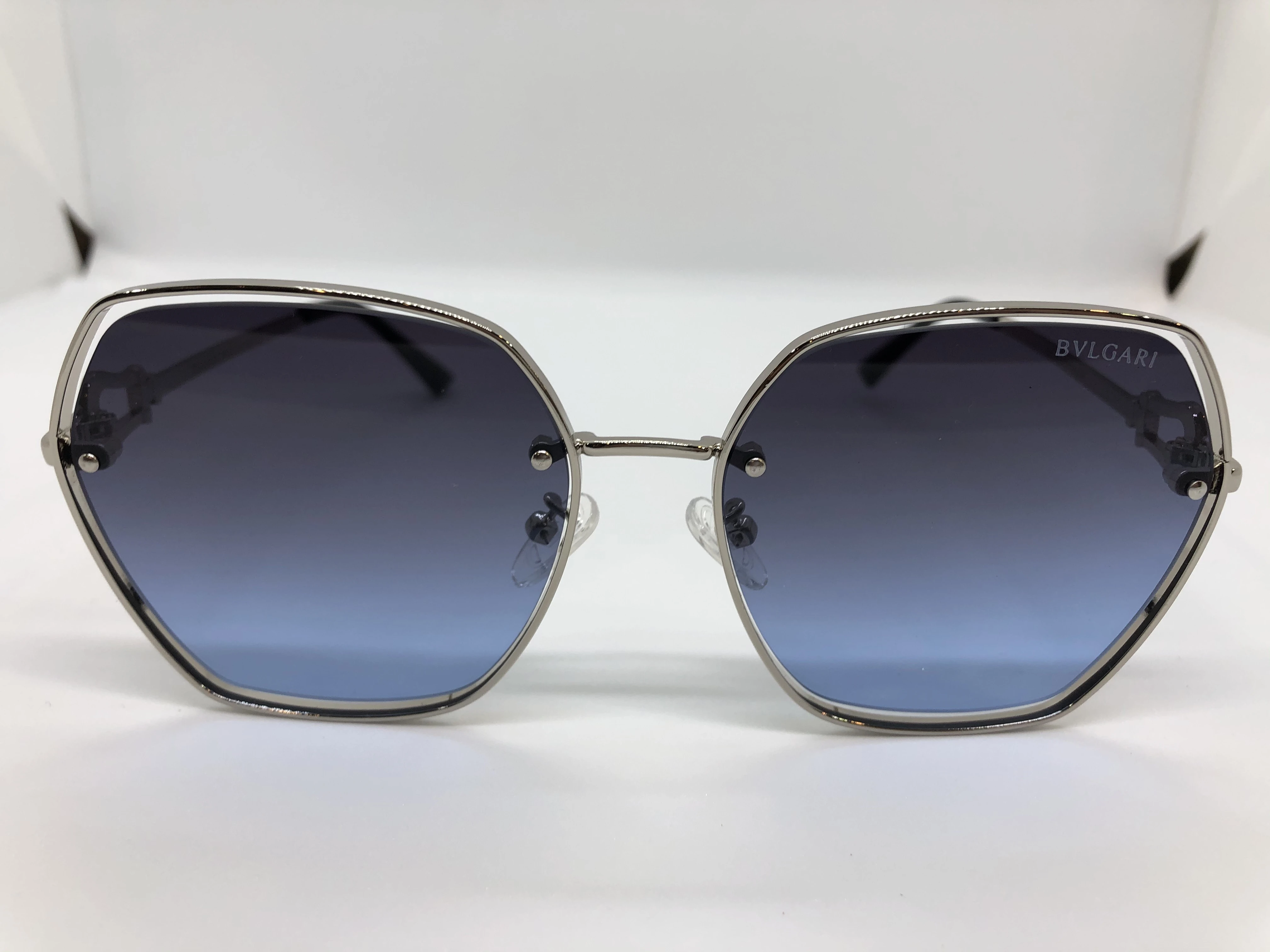 Sunglasses - from Bvlgari - silver metal frame - blue tinted lenses - silver metal arm - silver brand logo - for women