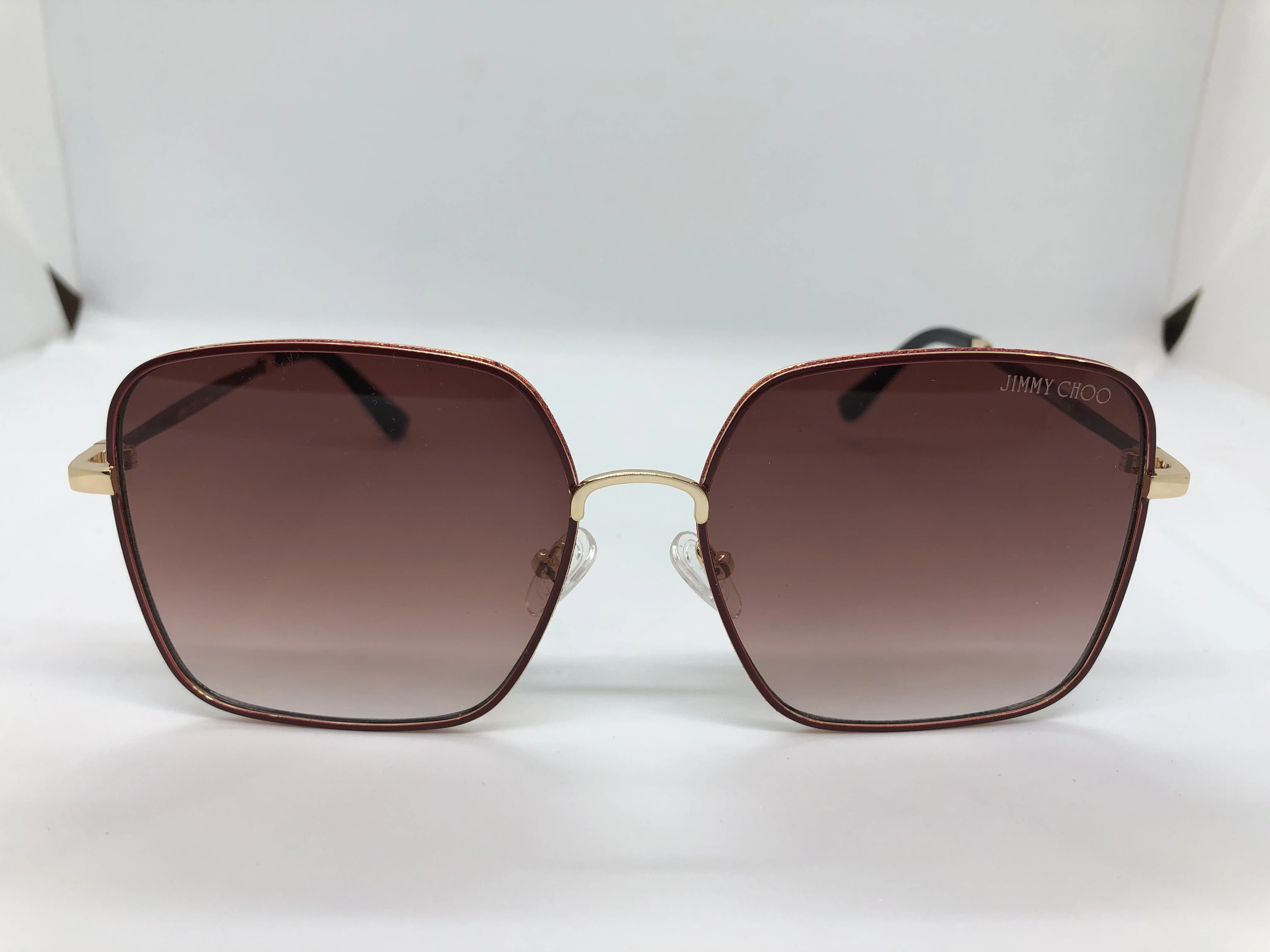 Sunglasses - from Jimmy Choo - with a golden * burgundy frame - with gradient burgundy lenses - and a golden and burgundy polycarbonate metal frame - for women
