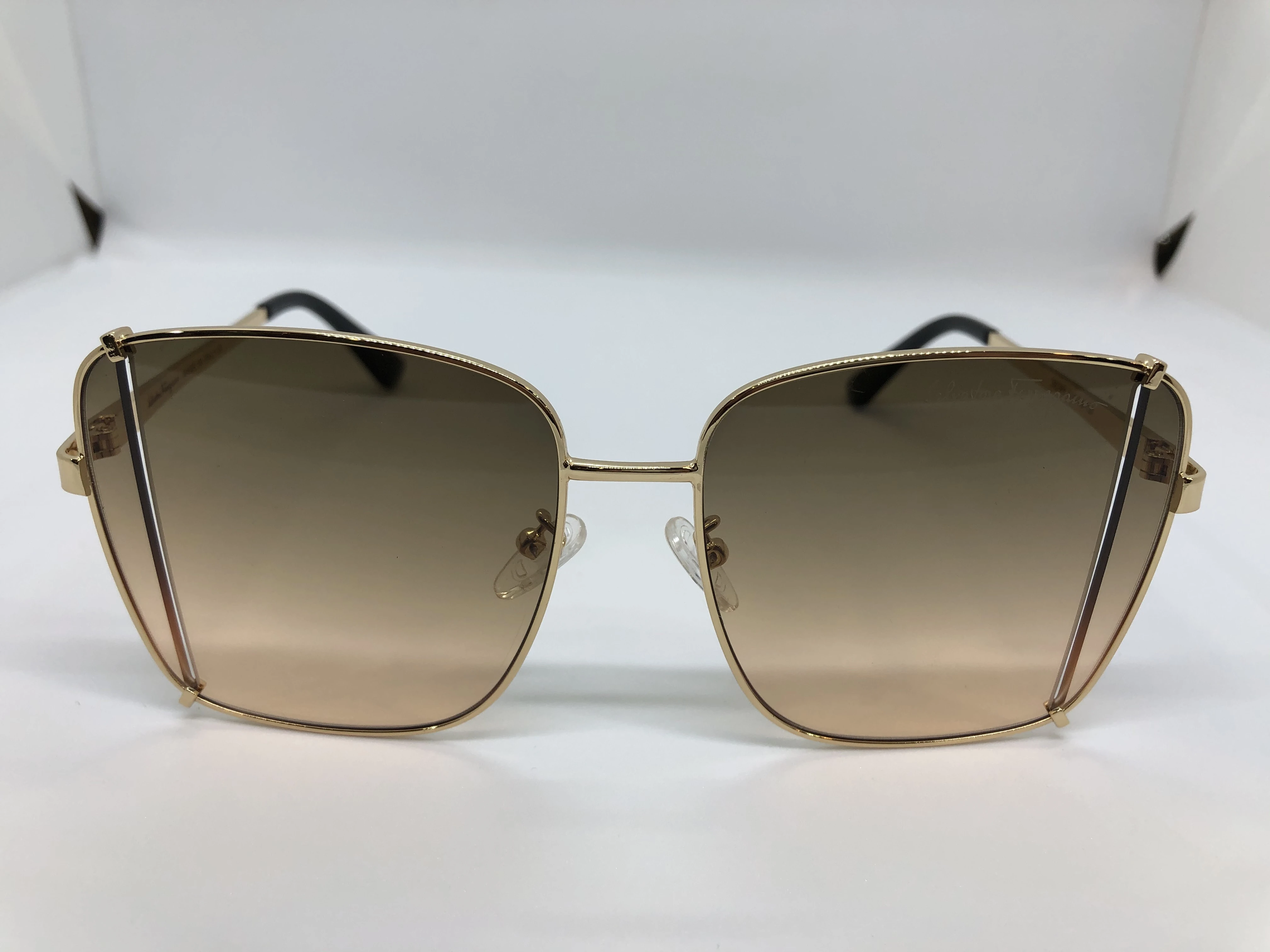 Sunglasses - from Salvatore Ferragamo - golden metal frame - transparent golden lenses - golden metal arm - for women