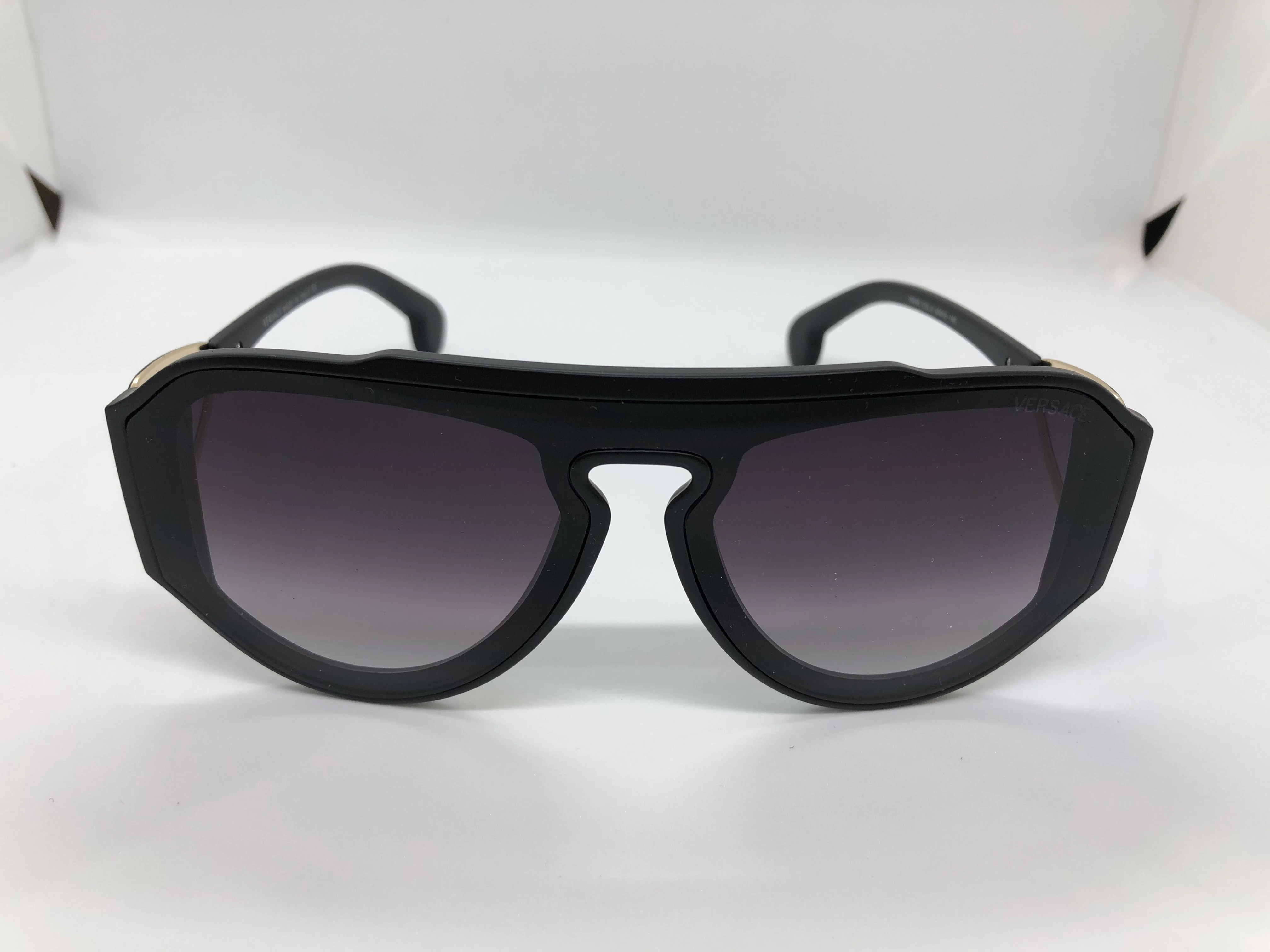 Sunglasses - from Versace - black polycarbonate frame - black gradient lenses - black polycarbonate arm - with a golden logo