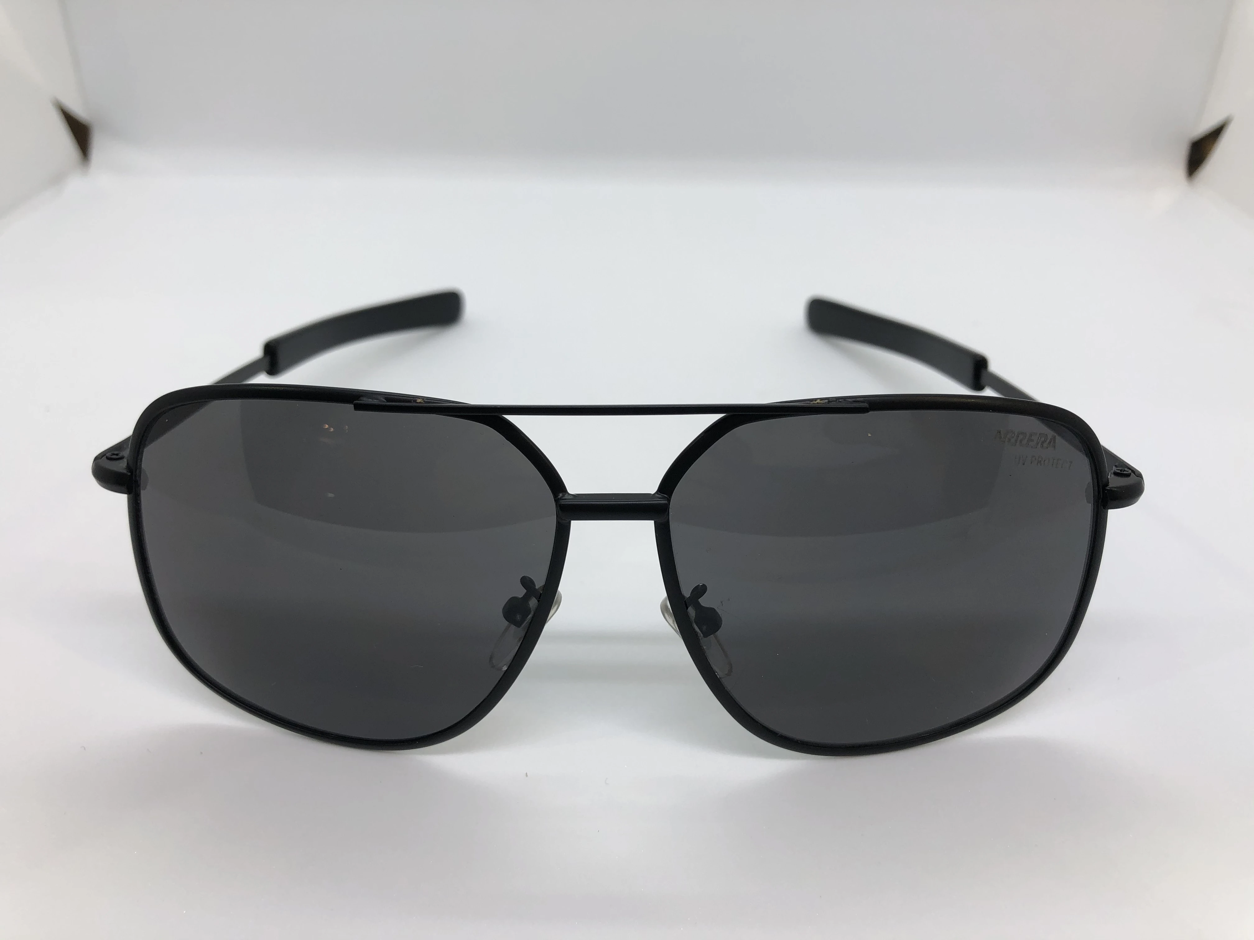 Sunglasses - from Carrera - with a black metal frame - and black lenses - and a black metal arm - for men