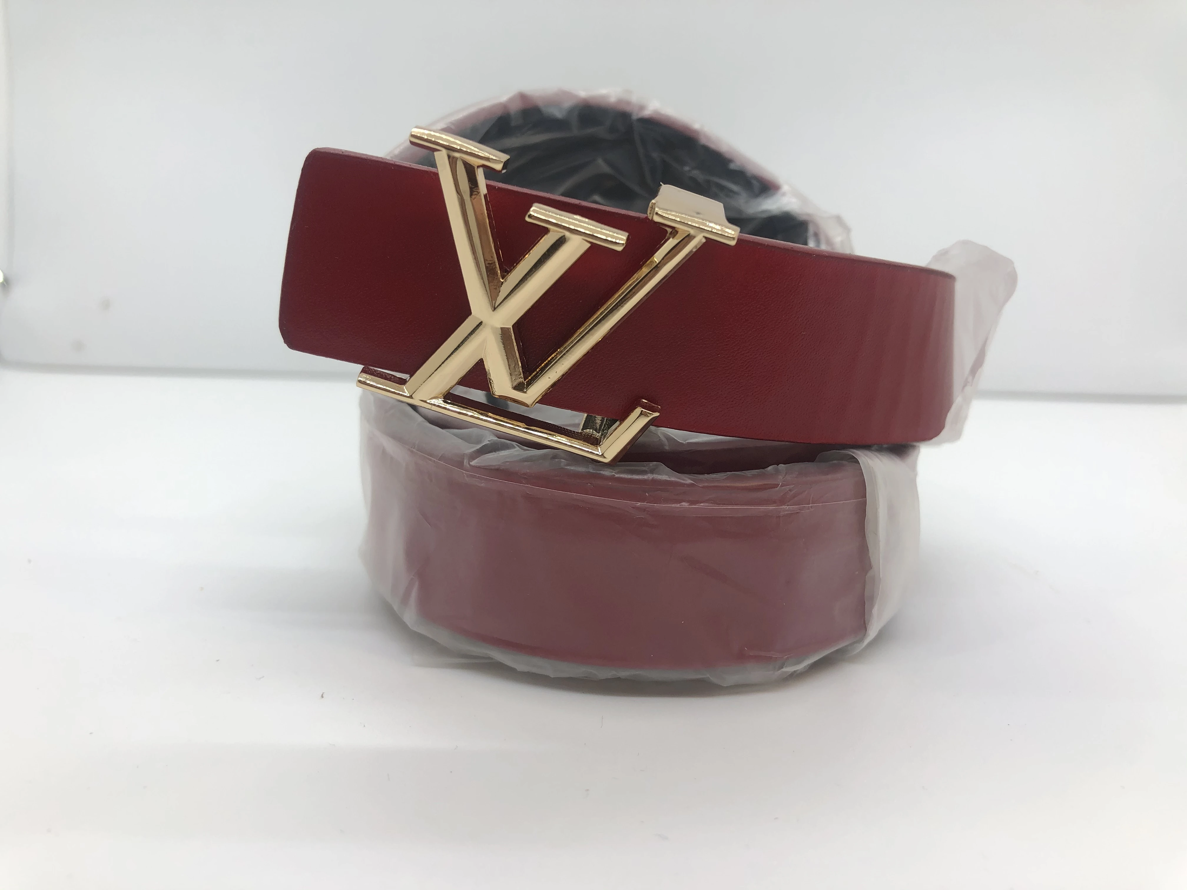Louis Vuitton women's belt, maroon, golden buckle, finished with the brand's logo