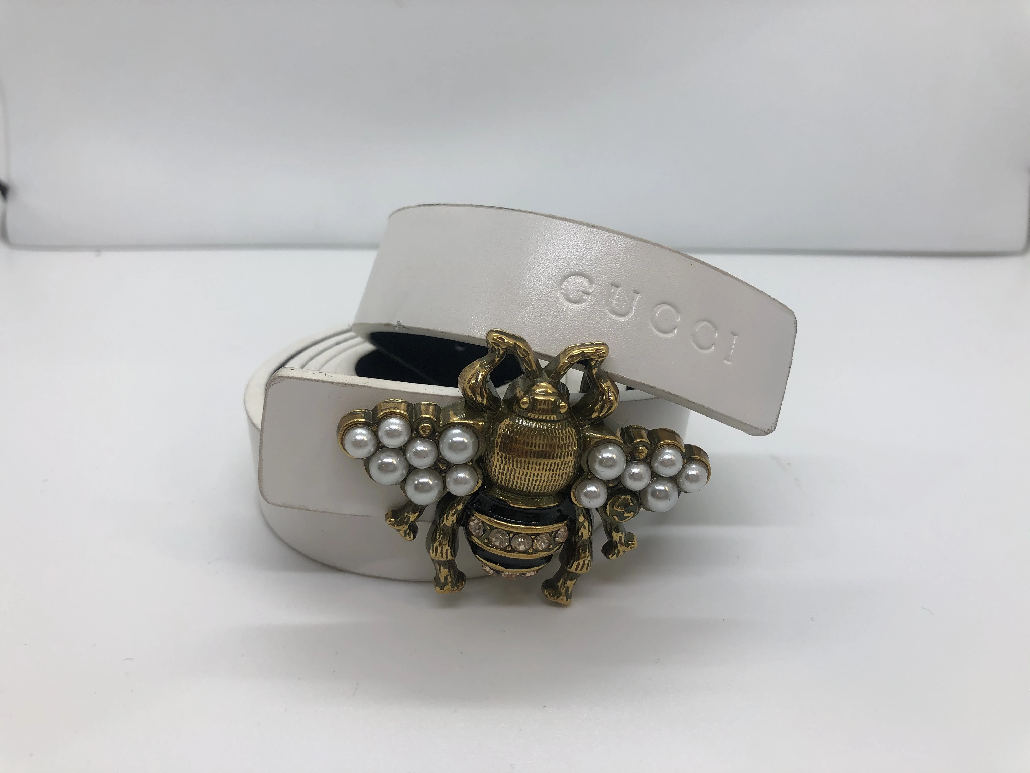 White Gucci women's belt, golden color butterfly buckle, with brand logo finishes