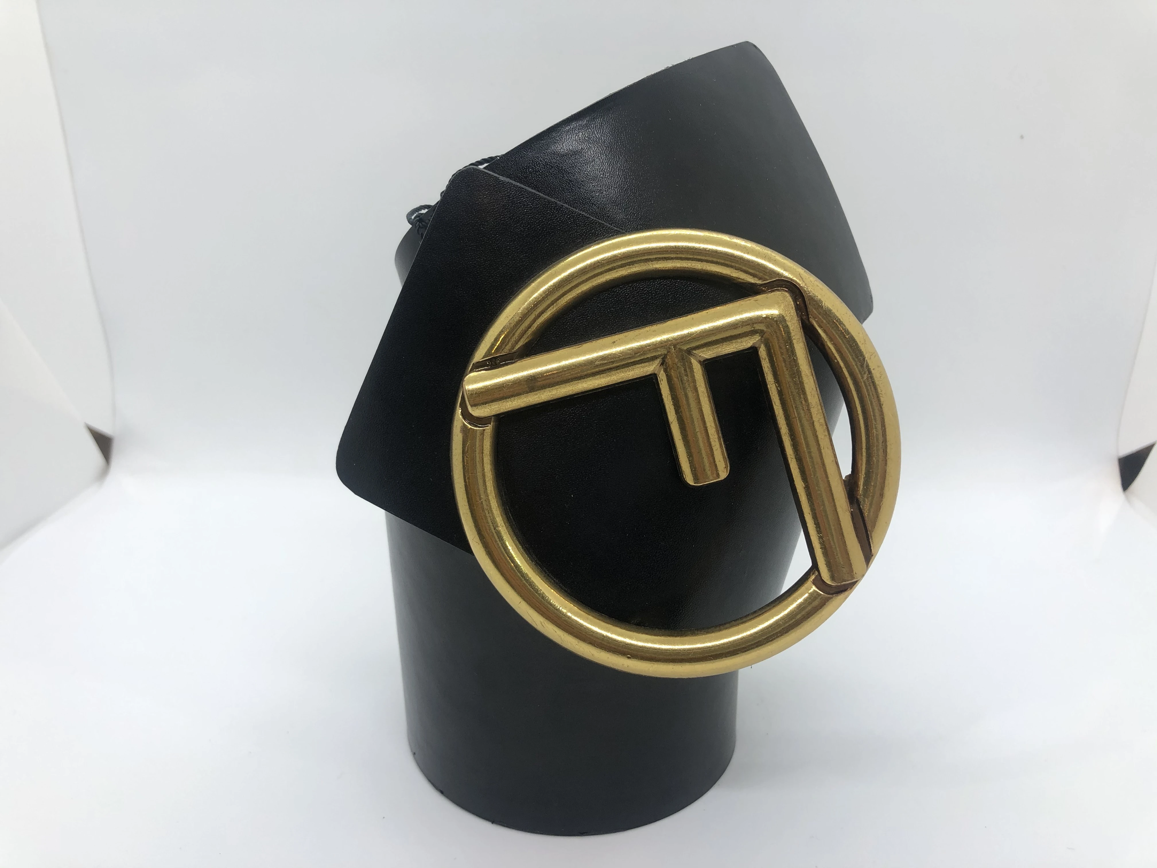 A black belt for women from Fendi .. A golden buckle with finishing touches with the brand's logo
