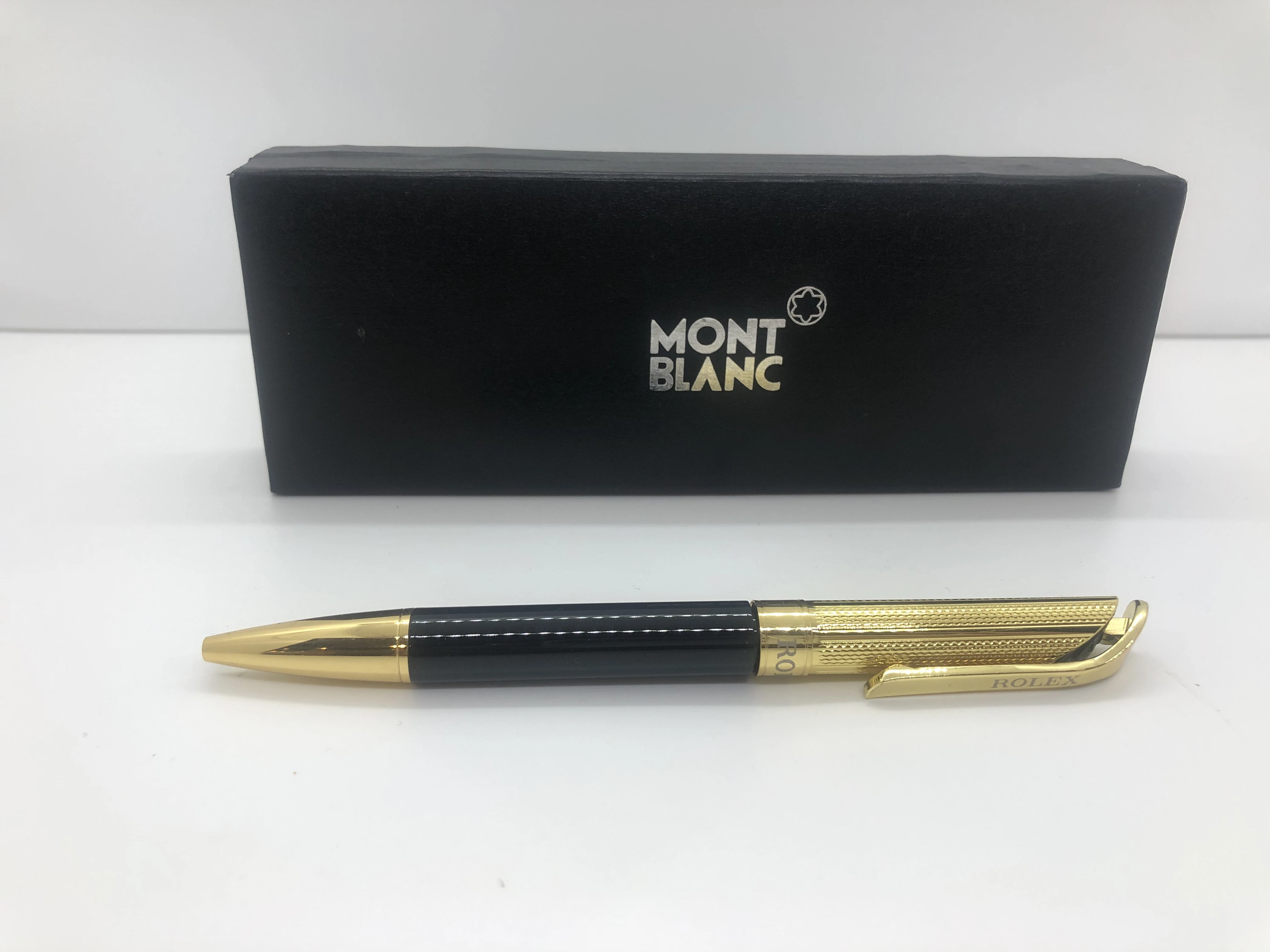 Rolex pen gold * black - with engraved touches - with the brand's logo on top, engraved with two rotors and a buckle