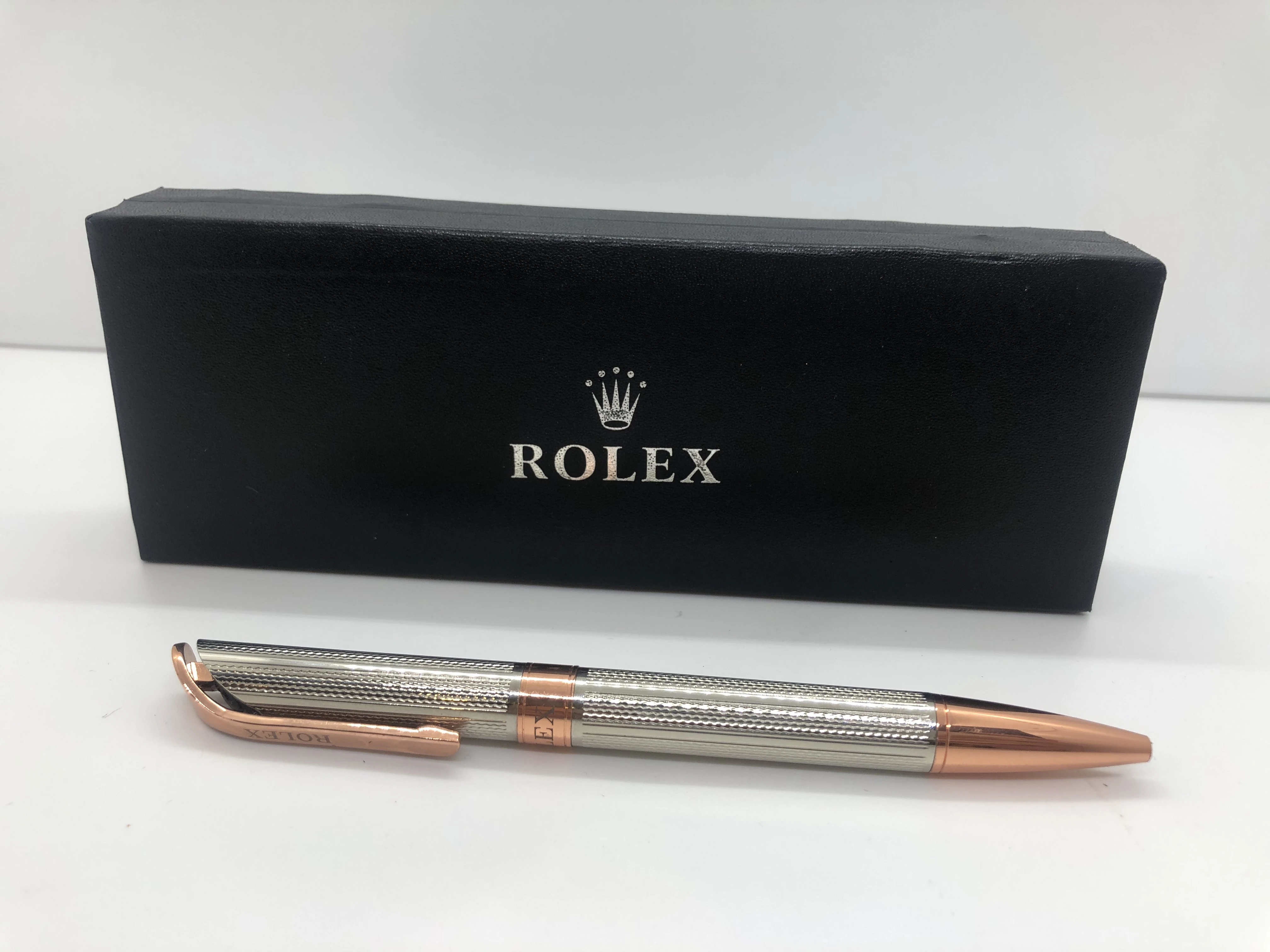 Rolex pen, rose gold * silver - with engraved finishes - with the brand's logo on top and engraved on the rotation and the clasp